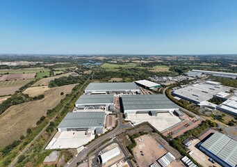 Aerial drone top down view of industrial warehouses and distribution centres, business park, near Birmingham england UK