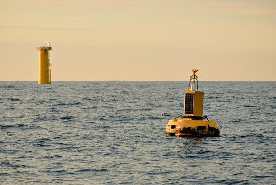 Marine Data Buoy with Solar Panel and Offshore Wind Farm Monopile Transition Piece,  Wind Farm Construction Survey