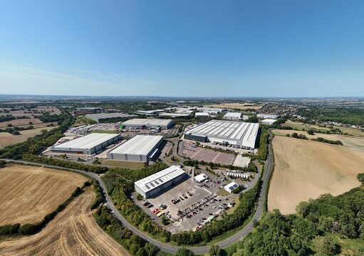 Aerial drone shot of industrial warehouses and distribution centres, supermarkets, economic heavy goods transport, in Tamworth England UK