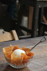 Vanilla Ice Cream with Waffle Cone Crisps in a Glass Bowl.