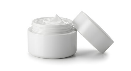 Luxury white cosmetic cream in an open jar with a swirled texture, lid resting beside, isolated on pure white background