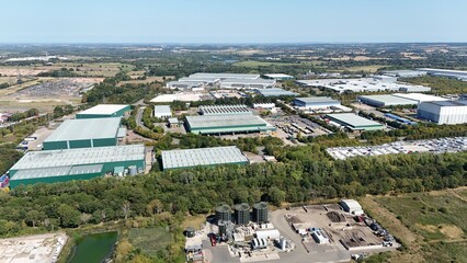 Aerial drone shot of industrial warehouses and distribution centres, supermarkets, economic heavy...