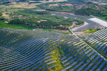 Photovoltaic panels on a hillside at sunset