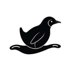 Black Silhouette of a Penguin Sliding on Ice Belly