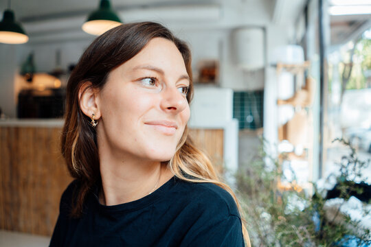 Thoughtful young woman in cafe
