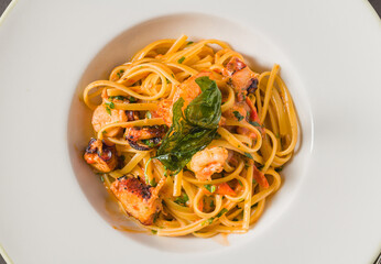 Linguine pasta with shrimp and seafood in tomato and garlic sauce