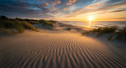 Fototapeta premium Stunning Golden Sunset over Serene Sand Dunes and Ocean Beach with Rippled Sand Textures, Capturing the Tranquil Beauty of a Coastal Evening.