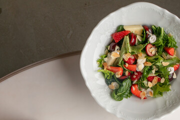 A vibrant mosaic of leafy greens and berries whispers of Midsummer feasts and whimsical forest picnics