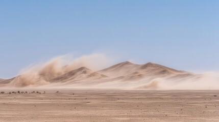 Strong wind whipping dust across a desert landscape.