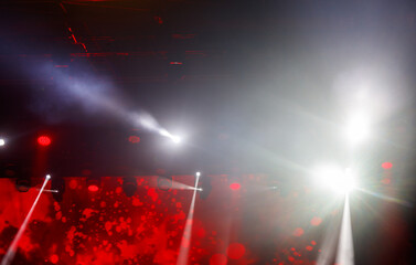 A stage with lights and a red background