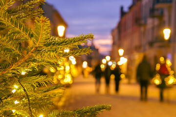 Blurred zoom out background city street with Christmas illuminations, blurred holiday background....