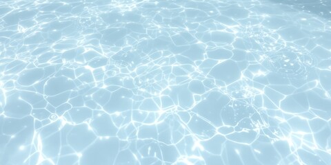 Obraz premium Bright sunlight creates shimmering patterns on clear blue water's surface with gentle ripples