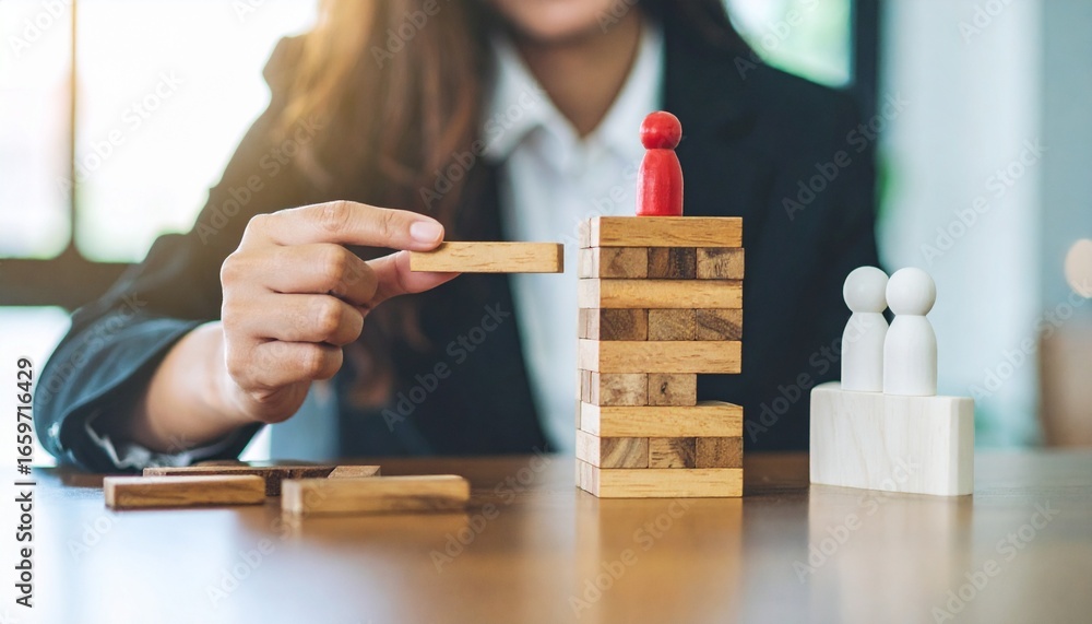 Poster a businesswoman builds a tower with blocks, strategically placing them with focused determination, w