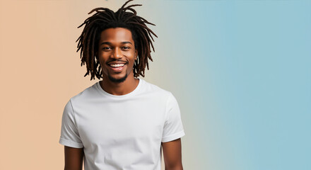 African American man with short dreadlocks in white t-shirt smiling against gradient background. Studio portrait for grooming and personal branding content
