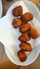 tray of croquettes presented vertically