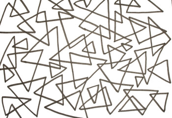 Close up of hand drawn doodle pen triangle square black lines and waves on white background