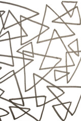 Close up of hand drawn doodle pen triangle square black lines and waves on white background