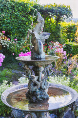  St. Kathrein am Offenegg, Styria, Austria - 09.08.2025, fountain in the garden