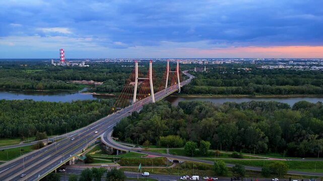 Aerial view of Warsaw's Siekierkowski bridge at dusk over Vistula river
