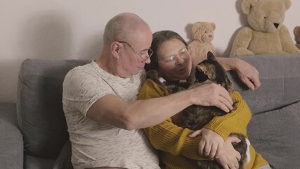 heartwarming scene mature family couple bonding with feline companion, finding comfort in each other's company, Human-animal bond - Powered by Adobe