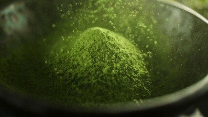 Freeze Motion Detail Shot of Sprinkling Matcha Powder