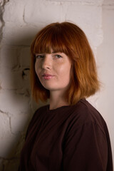 Portrait of redhead woman with calm serious expression. Concept of individuality, lifestyle,...
