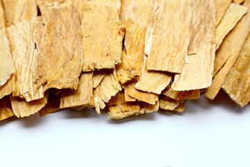 Dried Astragalus root slices used in traditional Chinese medicine.