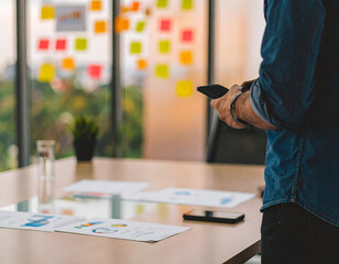 Startup Founder Planning Digital Marketing Strategies Using Smartphone