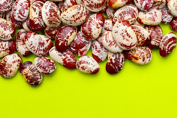 Speckled lima beans with red white patterns.