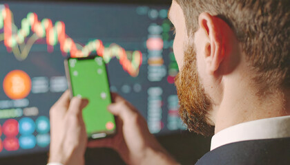 Startup Founder Planning Strategy with Smartphone and Chart Analysis