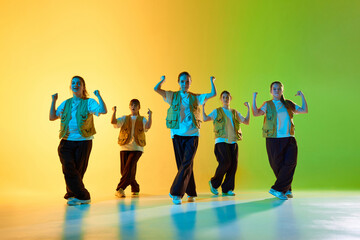 Youthful dancers energize a vibrant background with synchronized urban choreography. Concept of dynamic urban expression and youthful creativity in dance.