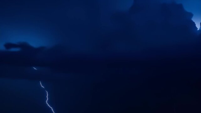 Dramatic Lightning Strike Across Dark Blue Stormy Sky during Night