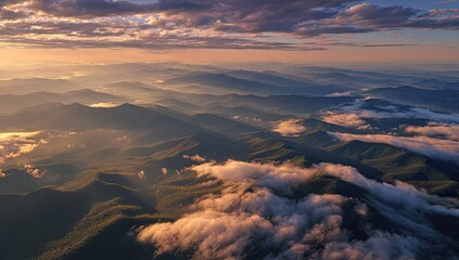 Aerial Sunrise Over Misty Mountain Ranges