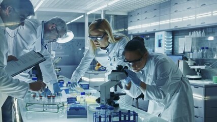 Medical Laboratory Scientists in  Coats Examine Samples Using Microscopes, Petri Dishes. Team Records Data and Do Research in a Laboratory Equipped With Scientific Instruments and Computers - Powered by Adobe