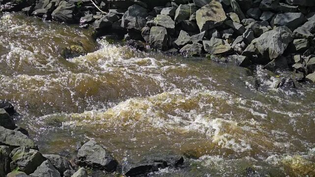 Water engineering with ditch that leads water to a river. Nice erosion preventing with rocks. 