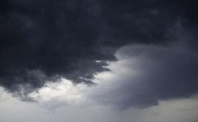 Obraz premium Clouds in the sky, background, beautiful stormy sky over the city. Gray, white, blue shades of the sky.