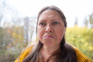 Mature unhappy woman looking offended, Upset middle aged female feeling hurt, emotional portrait,...