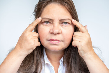 50 year old female with eye irritation, speck, Mature woman with tired eyes, optical discomfort,...