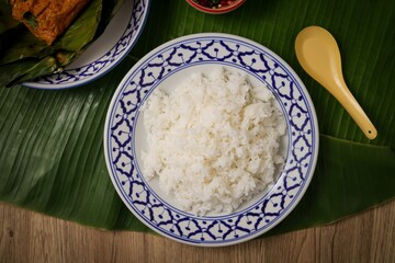 Cooked white rice or steamed rice in ceramic  plate, thai jasmine rice, thai fragrant rice