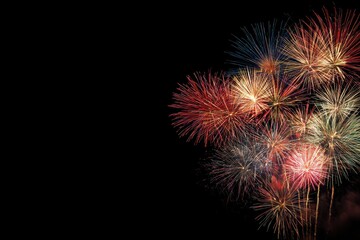 Fototapeta premium colorful fireworks blooming in the sky, creating an atmosphere of celebration