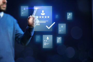 Man interacting with digital interface to evaluate user profiles with ratings and selections in a modern workspace setting