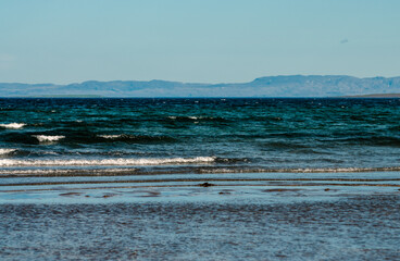 surf waves of clear blue waters of the Arctic Ocean