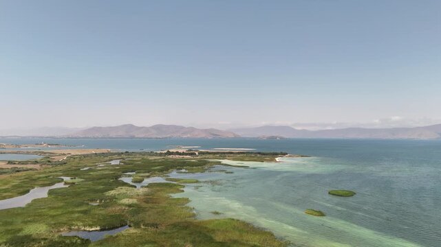 Aerial Drone of Lake Sevan is the largest body of water in both Armenia and the Caucasus region. It is one of the largest freshwater high-altitude (alpine) lakes in Eurasia