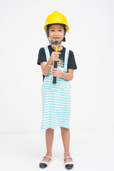 A goofy young Asian girl standing tall while holding a hammer, wearing a protective hat, and smiling excitedly with playful energy. Isolated on a white background.