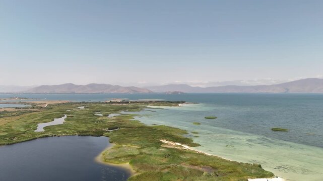 Aerial Drone of Lake Sevan is the largest body of water in both Armenia and the Caucasus region. It is one of the largest freshwater high-altitude (alpine) lakes in Eurasia