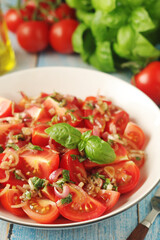 A bowl with Romanian tomato salad de Rosii	