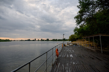Wooden pier near the river close-up