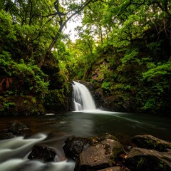 Naklejka premium Lush waterfall cascading into a tranquil pool, framed by verdant forest
