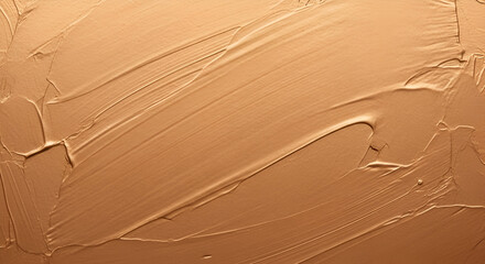 A close-up macro shot of brown clay texture with smooth brush strokes, creating an earthy natural background for beauty and skincare themes.
