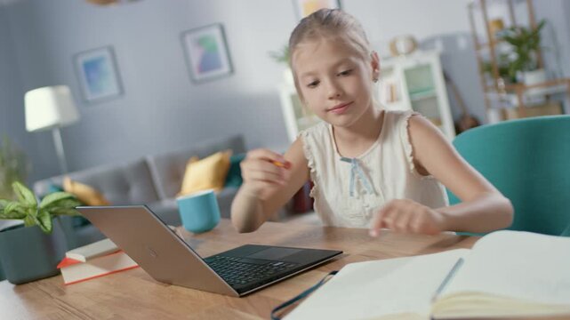 Young Girl Studying at Home on a Laptop, Completing Assignments and Digital Exercises. Focused on Learning, and Skill building Through Online Education, Supporting Academic Progress, Personal Growth